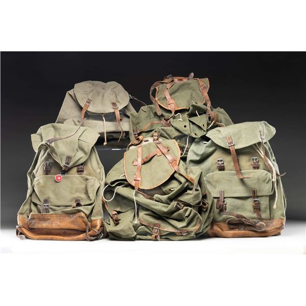 GROUPING OF FIVE MILITARY BACKPACKS.
