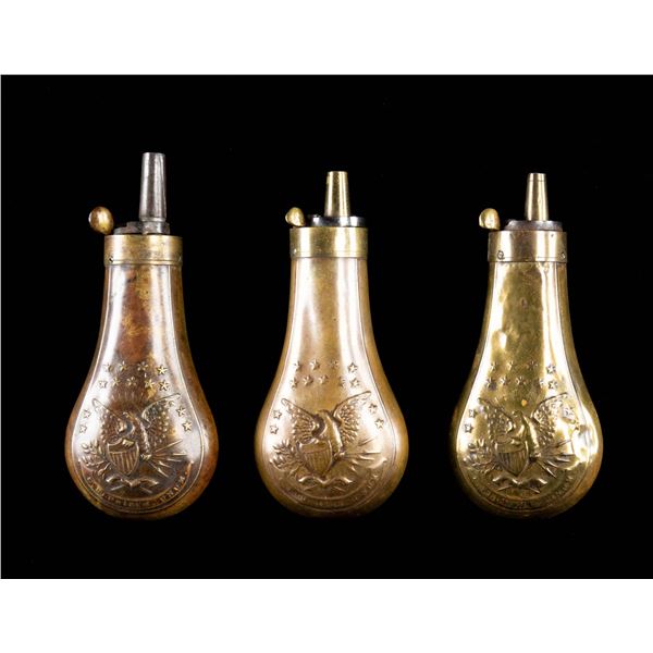 THREE EAGLE PISTOL FLASKS.