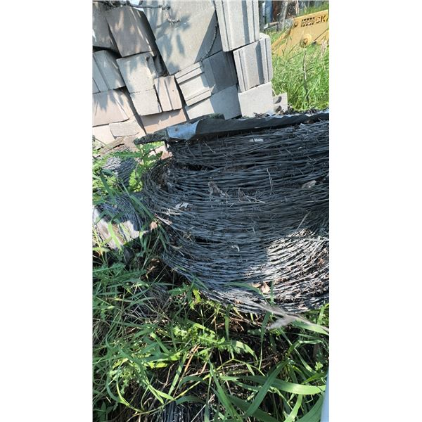 Coils of Barbed Wire Fencing