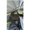 Image 1 : Stack Of Reclaimed Lumber Stored Under Metal Roof