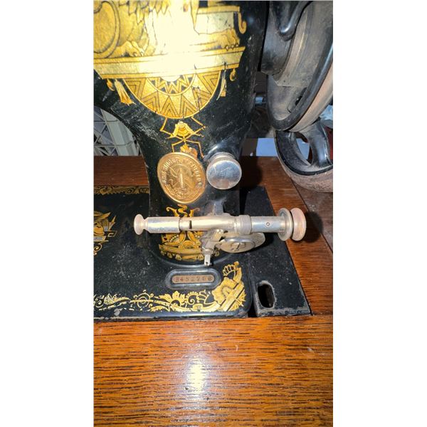 Singer Treadle Sewing Machine with Oak Cabinet and Drawers
