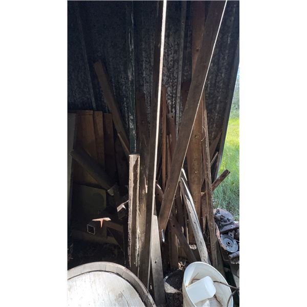 Used Tires, Rims, Scrap Lumber, and Red Tool Cabinet