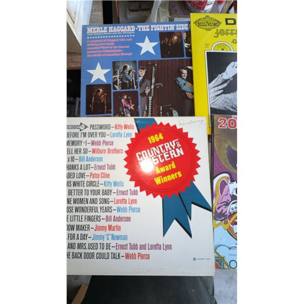 4 Country Vinyl Records Including Merle Haggard and Jerry Lee Lewis