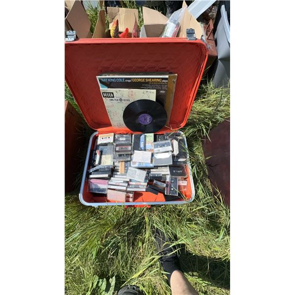 Red Suitcase With Vinyl Records and Cassette Tapes