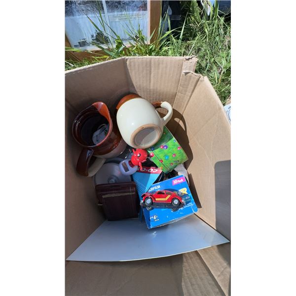 Box Lot with Stoneware Jugs, Toy Car, DVDs, Tin, and Sign