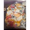 Image 1 : Bag of Mixed Vintage Postage Stamps on Paper Assorted Colours and Designs