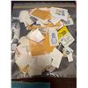 Image 1 : Postage Stamps on Paper in Plastic Bag