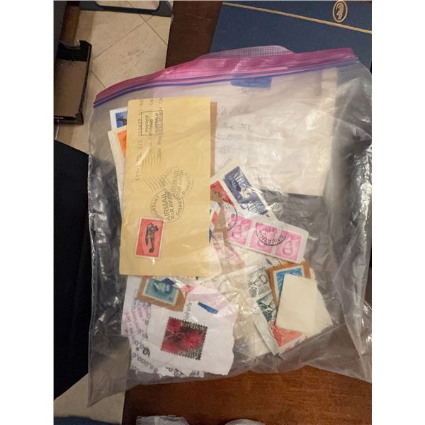 US and International Postage Stamps and Envelopes in Plastic Bag