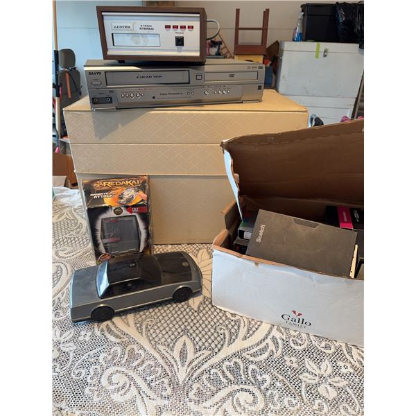 Electronics Lot: Lloyd's 8-Track, Sanyo VCR, Redakai, Car Rewinder, VHS Tapes
