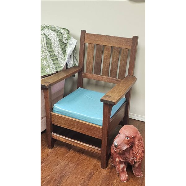 Wooden Armchair With Blue Cushion and Ceramic Dog Statue