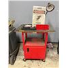 Image 1 : L2 - Rolling Red dolly w/ padded top, sign & misc. tools