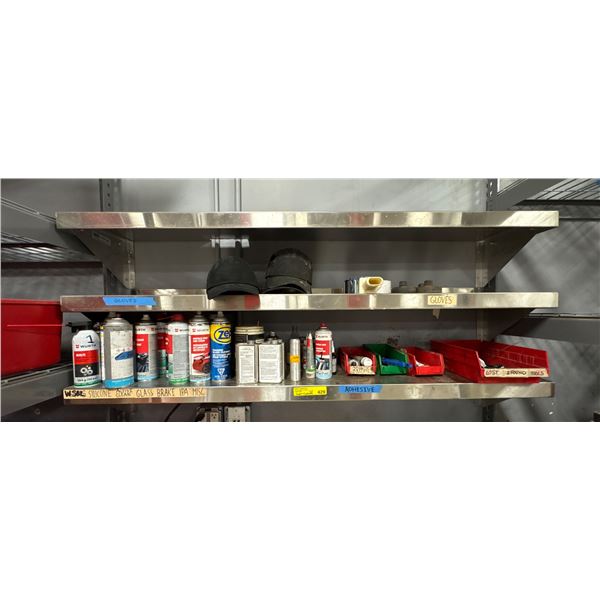 L2 - Stainless steel shelf w/ glass cleaners, rubber care products, adhesives, etc.