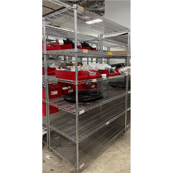L2 - Steel wire rack & contents including phone dock, panels, Cybertruck wheel covers, etc.