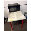 Image 1 : L2 - Panasonic Black Countertop Microwave Oven on White Utility Table with Red Legs