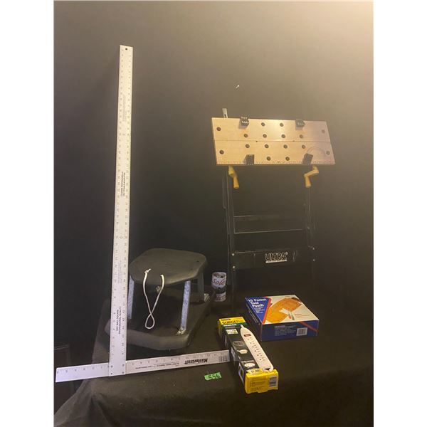 Assorted lot of tool items including work bench, stool on casters, drywall square and more