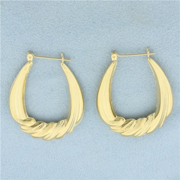 Large Oval Twisting Design Hoop Earrings in 14k Yellow Gold