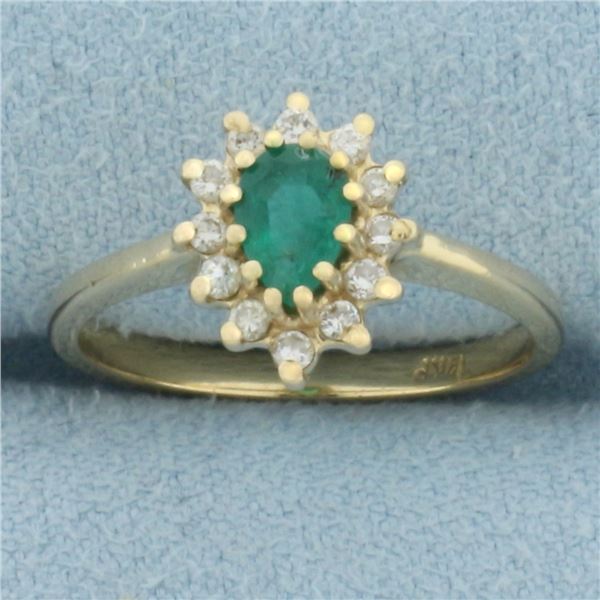Emerald and Diamond Halo Ring in 14k Yellow Gold