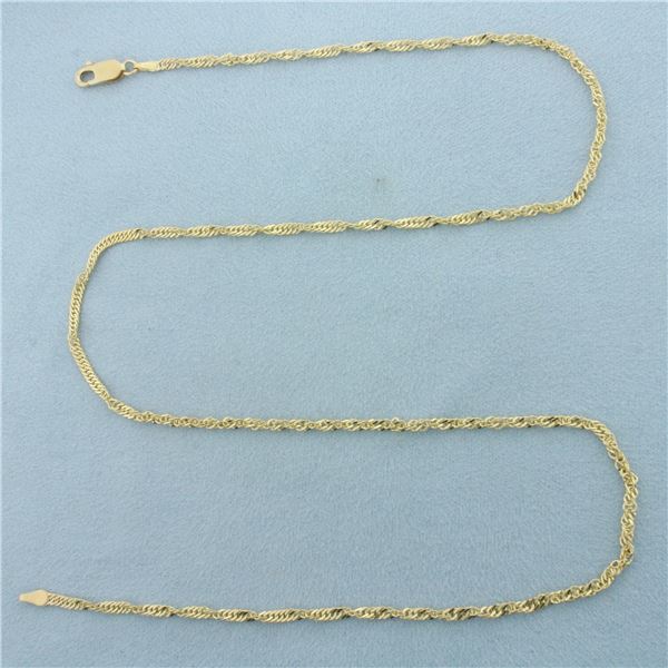 20 Inch Twisting Curb Link Chain Necklace in 14k Yellow Gold