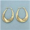 Image 1 : Swirl Hoop Earrings in 10k Yellow Gold