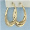 Image 2 : Swirl Hoop Earrings in 10k Yellow Gold