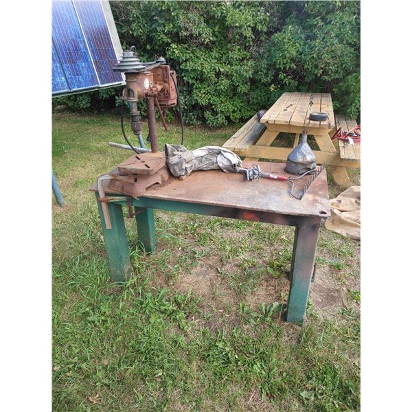 Drill press with steel table