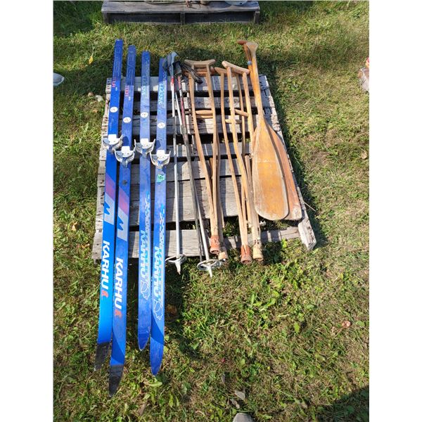 2 pairs of skis, 1 pair of poles, 2 paddles 2 pairs of crutches