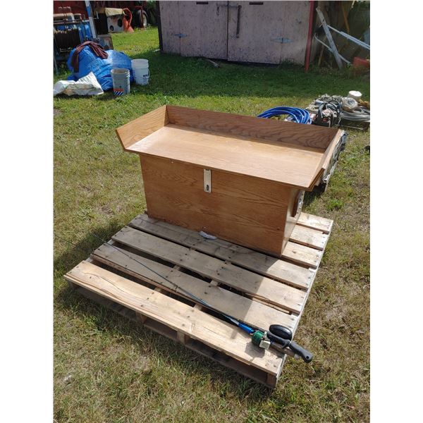 Wooden chest with axe and 2 fishing rods