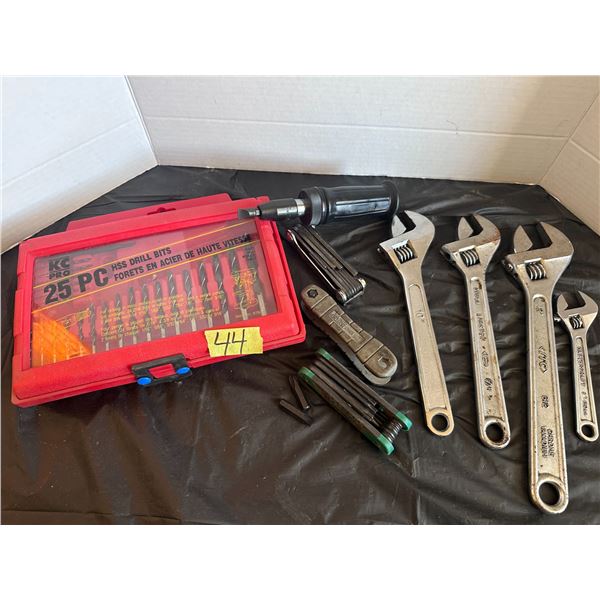 Assorted hand tools including wrenches, drill bit set, allen key set and more