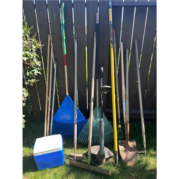 Assorted lot of garden tools, handles, rakes and cooler