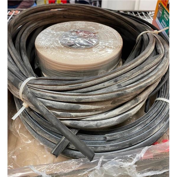 2 ROLLS OF SHUR-TAPE AND 2 BUNDLES OF 1/4IN SOME SORT OF RUBBER HOSE