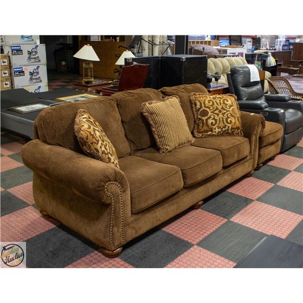 BROWN SOFA AND FOOT OTTOMAN BY ASHLEY FURNITURE