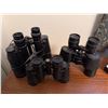 Image 1 : Three Binoculars: Bushnell, Hensoldt, and Nashica