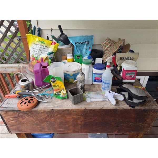 Garden Table with Fertilizers, Tools, and Potting Soil