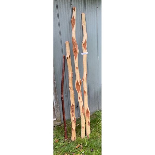 Four Hand-Carved Wooden Walking Sticks