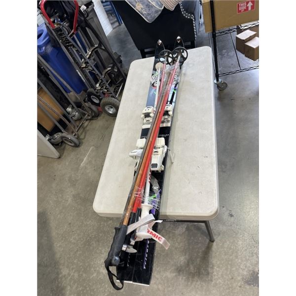 PAIR OF RISSIGNOLTORRION BOX SKI'S AND SKI POOLS