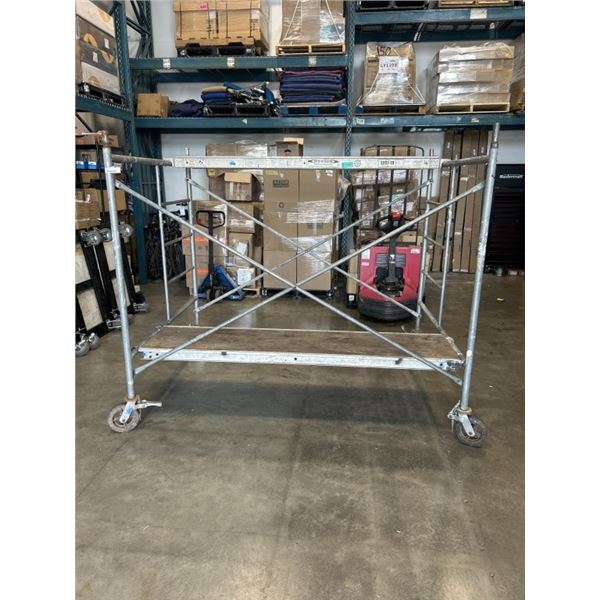 SINGLE SECTION OF SCAFFOLDING WITH WHEELS AND 2 PLANKS. DIMENSIONS ARE 72" HEIGHT (WITH WHEELS), 86"
