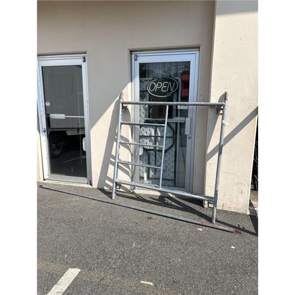 SINGLE SECTION OF SCAFFOLDING , NO PLANKS OR WHEELS. MISSING 1 SUPPORT POLE. 65" HEIGHT, 123" LENGTH