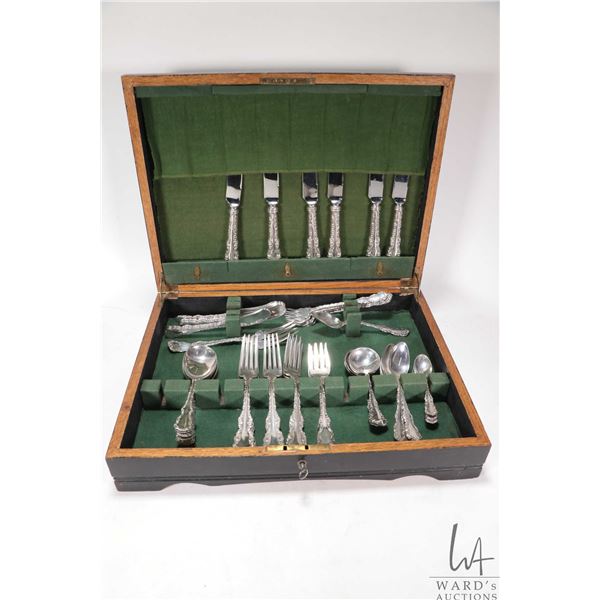 Boxed set of Louis XV sterling silver flatware including six dinner knives, ten dinner forks, six de