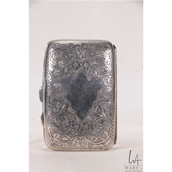 Antique Edwardian sterling silver cigarette case with British hallmarks of 1909 and intricate scroll