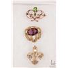 Image 1 : Three antique brooches including tested 14kt yellow gold set with peridot like green gemstones, and 