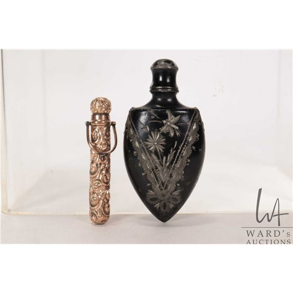 Antique Victorian etched steel scent bottle and an antique Victorian gold toned repousse telescoping