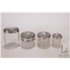 Image 1 : Four antique dresser jars, each with cut glass bases and sterling silver repoussee lids dated from 1