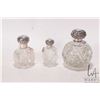 Image 1 : Three antique repousse silver topped perfumes including large cut glass with original crystal stoppe