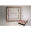 Image 1 : Game box with vintage Monopoly board and checker game on verso with game pieces and dice plus a boxe