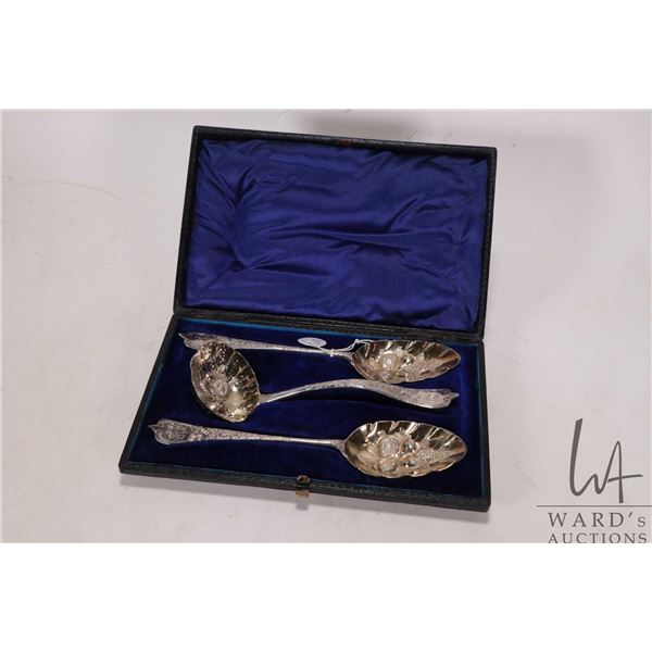 Boxed set of possibly Georgian sterling silver berry spoons including sifter, each with early Englis