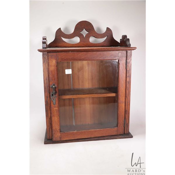 Vintage oak two shelf cabinet with fretwork topper and glazed door, 21" H X 15" W X 6 1/4" D