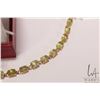 Image 2 : 14kt yellow gold and peridot gemstone bracelet, size 7" and a pair of 14kt yellow gold and peridot e