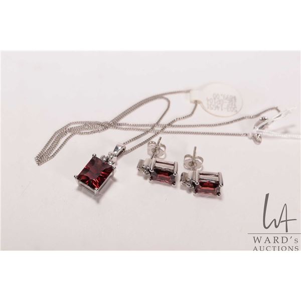 14kt white gold pendant set with garnet gemstone and small diamonds and a pair of matching 14kt whit
