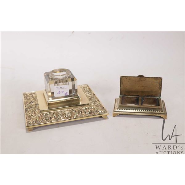 Antique brass inkwell with decorative scroll and grotesque mascaron detailing and clear bevelled cry