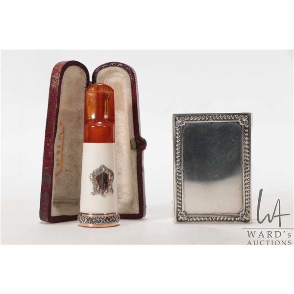 Antique Edwardian amber and Meerschaum cigar holder in fitted leather case and a Birks sterling silv